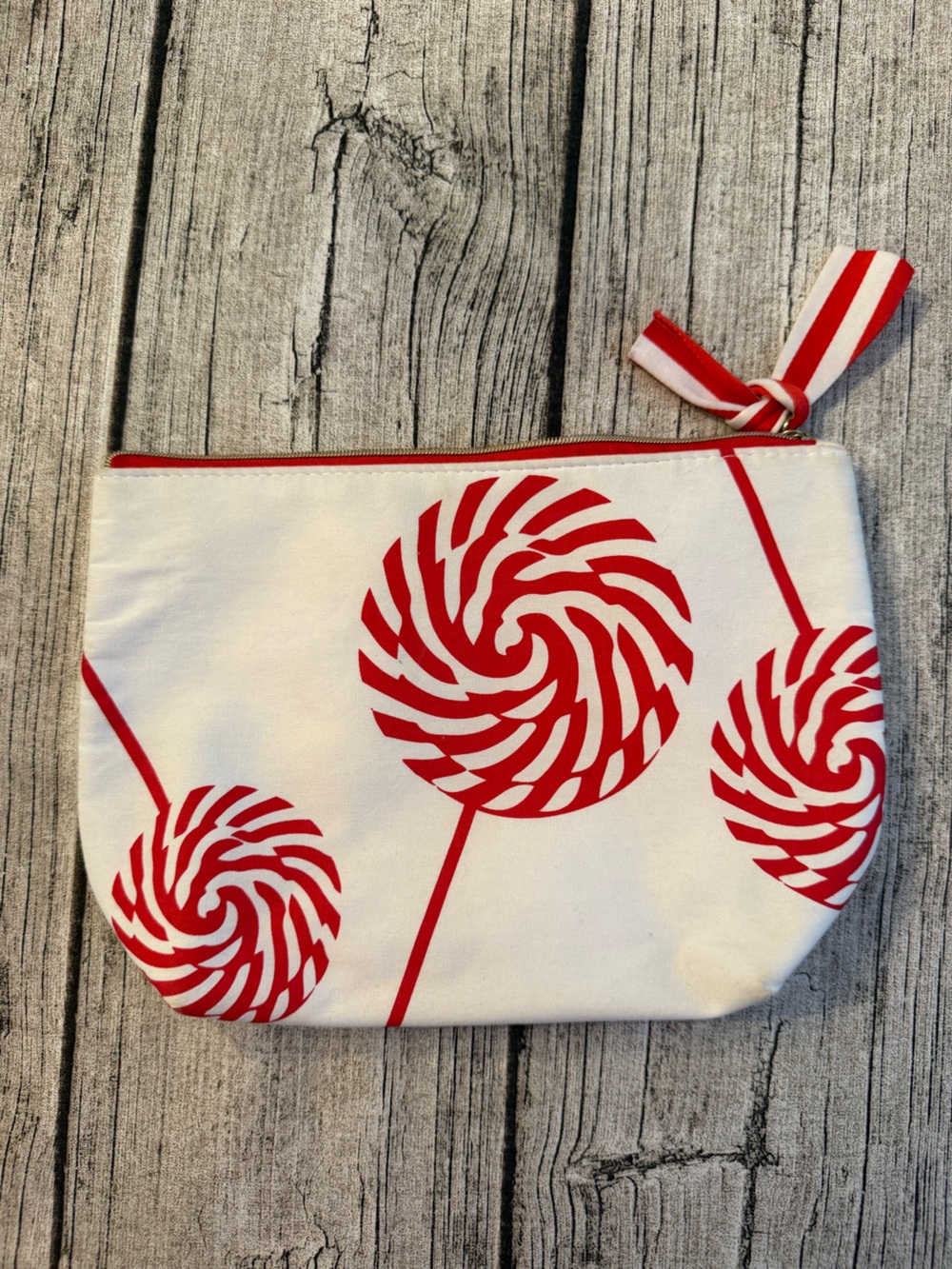 Clarins cotton bag with peppermint print and tassel. Zippered